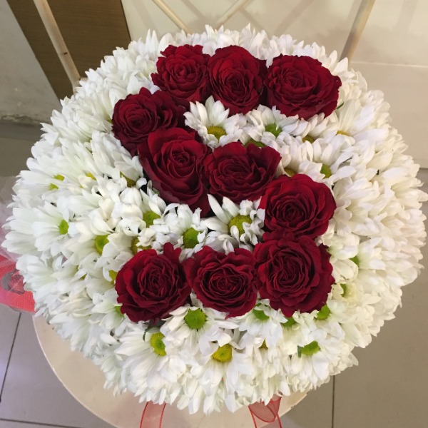 Flower arrangement in box with an S letter 